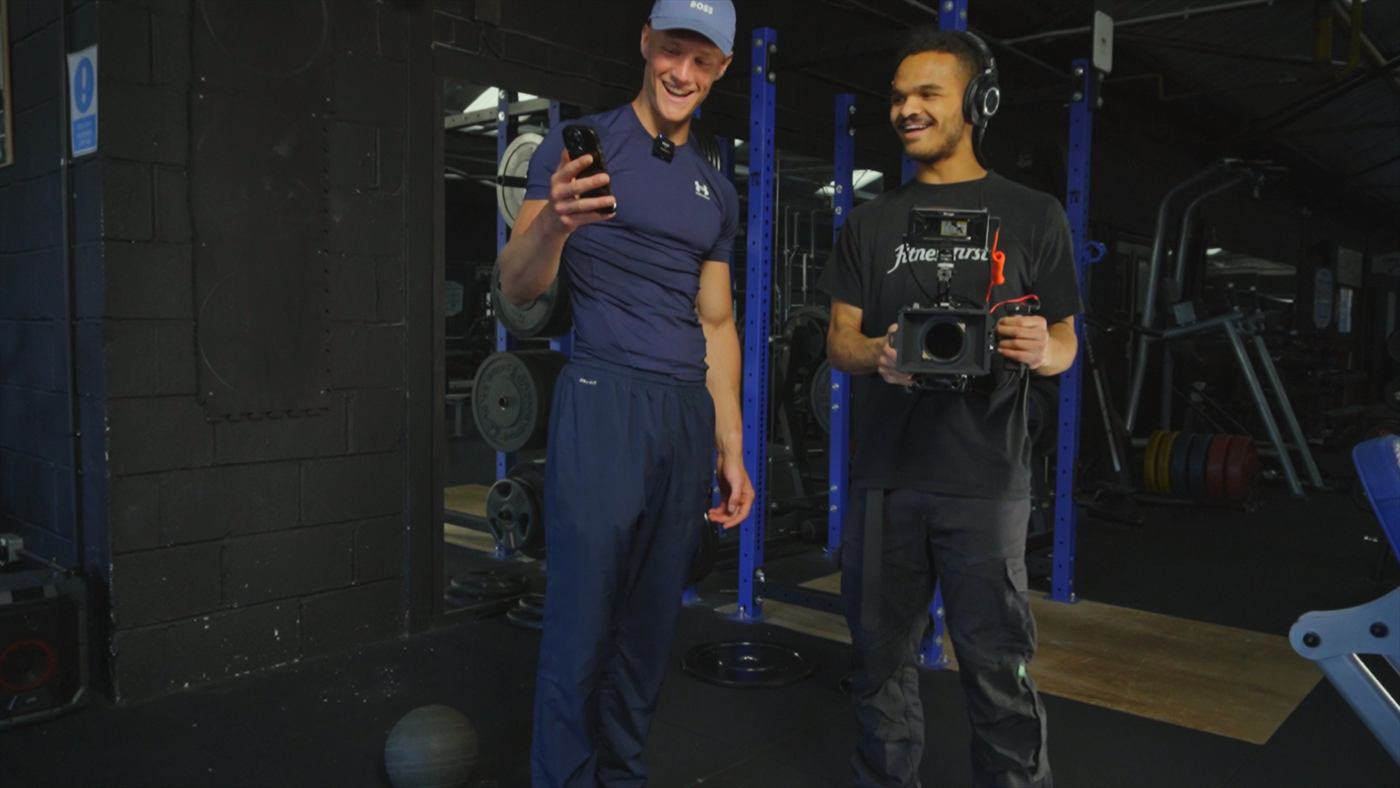 Filming behind the scenes in the gym with a cinema camera